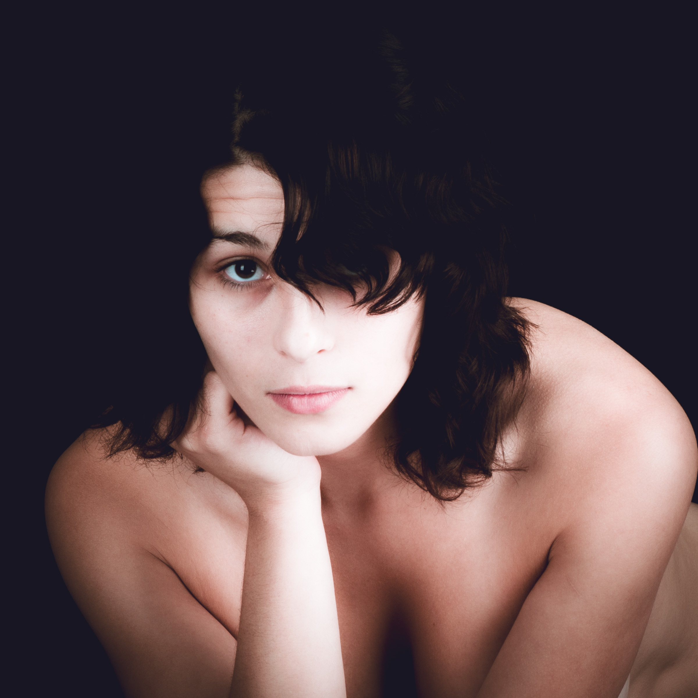 Black and white boudoir beauty portrait photographed in a private Las Vegas studio