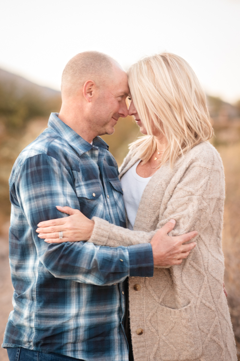 Couple holding each other during a relaxed outdoor Las Vegas photoshoot