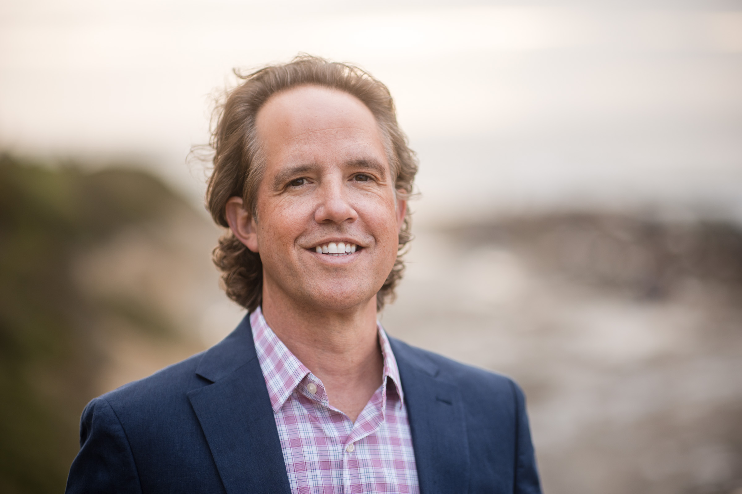 Relaxed professional headshot photographed on location in natural light