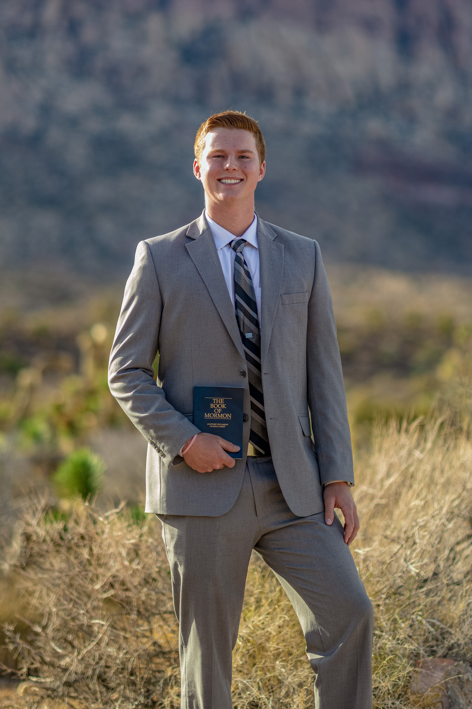 Man in a grey suit photographed on location at Red Rock Canyon near Las Vegas