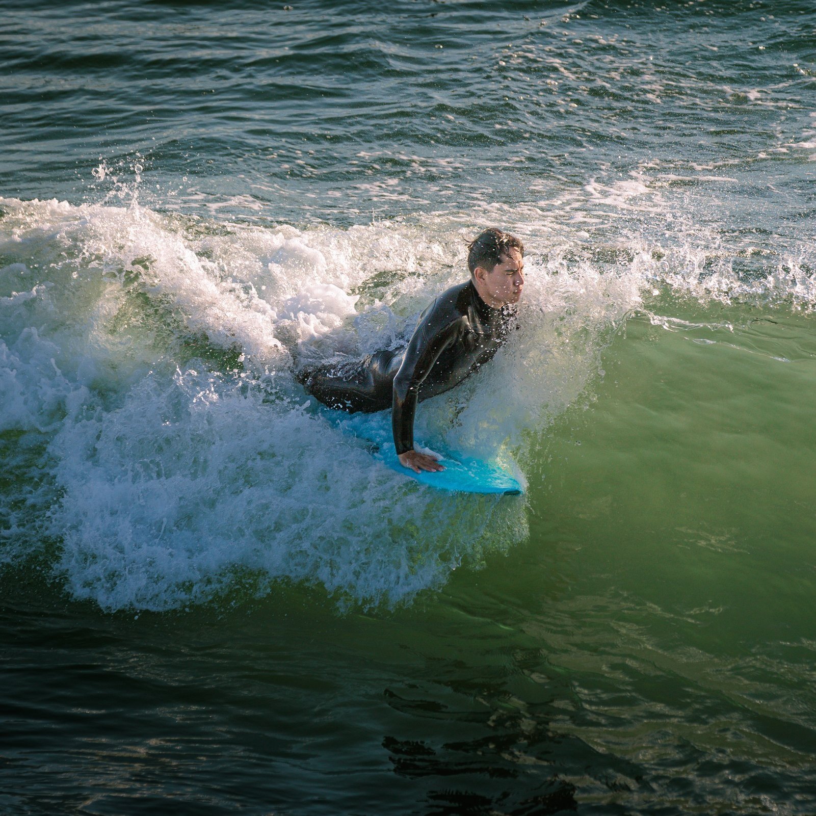 A surfer riding a breaking wave.