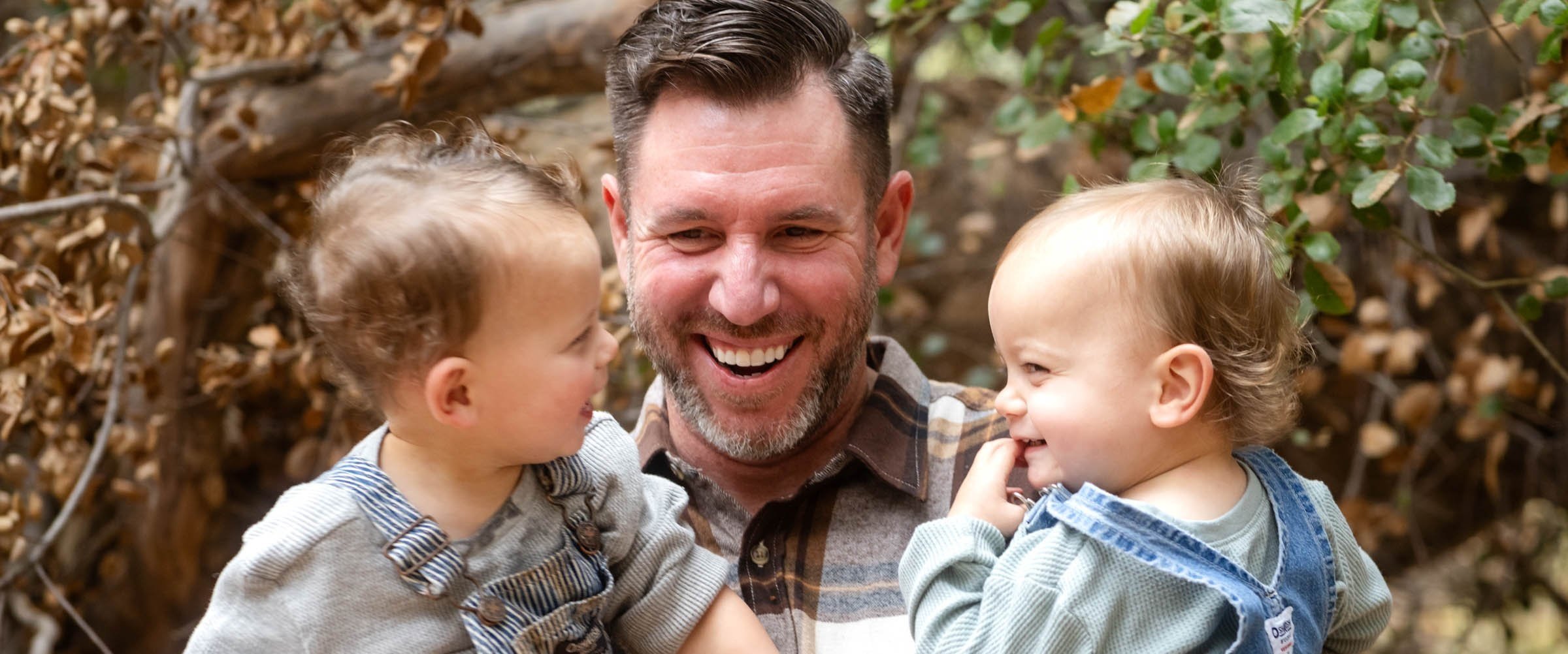 Father laughing with his toddlers during a Las Vegas family mini photography session